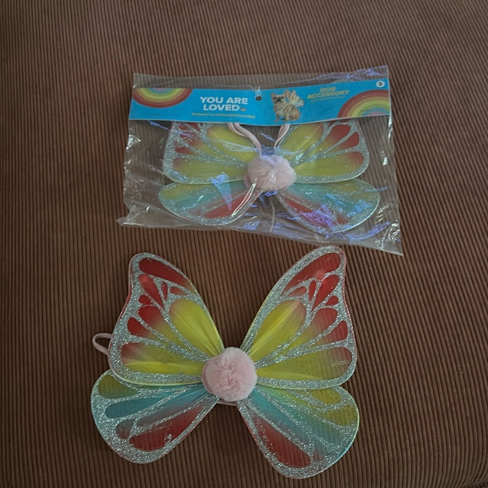 2 doggie wing accessories. One opened but worn by my daughter. New.